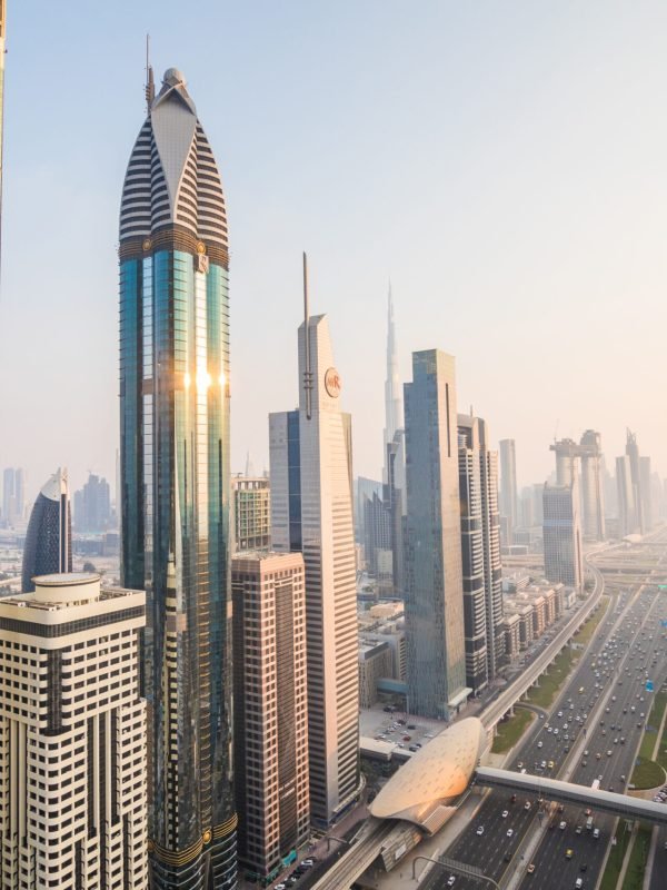 Dubai, UAE - October, 2018. Dubai skyline and downtown skyscrapers on sunset. Modern architecture with highrise buildings on world famous metropolis in United Arab Emirates